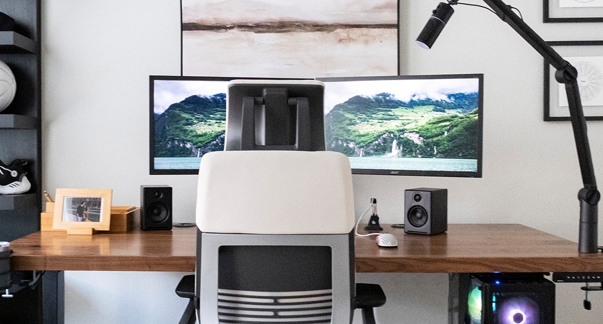 Clamp-On Microphone Arm by UPLIFT Desk positioned on the right-hand side for customizable placement.