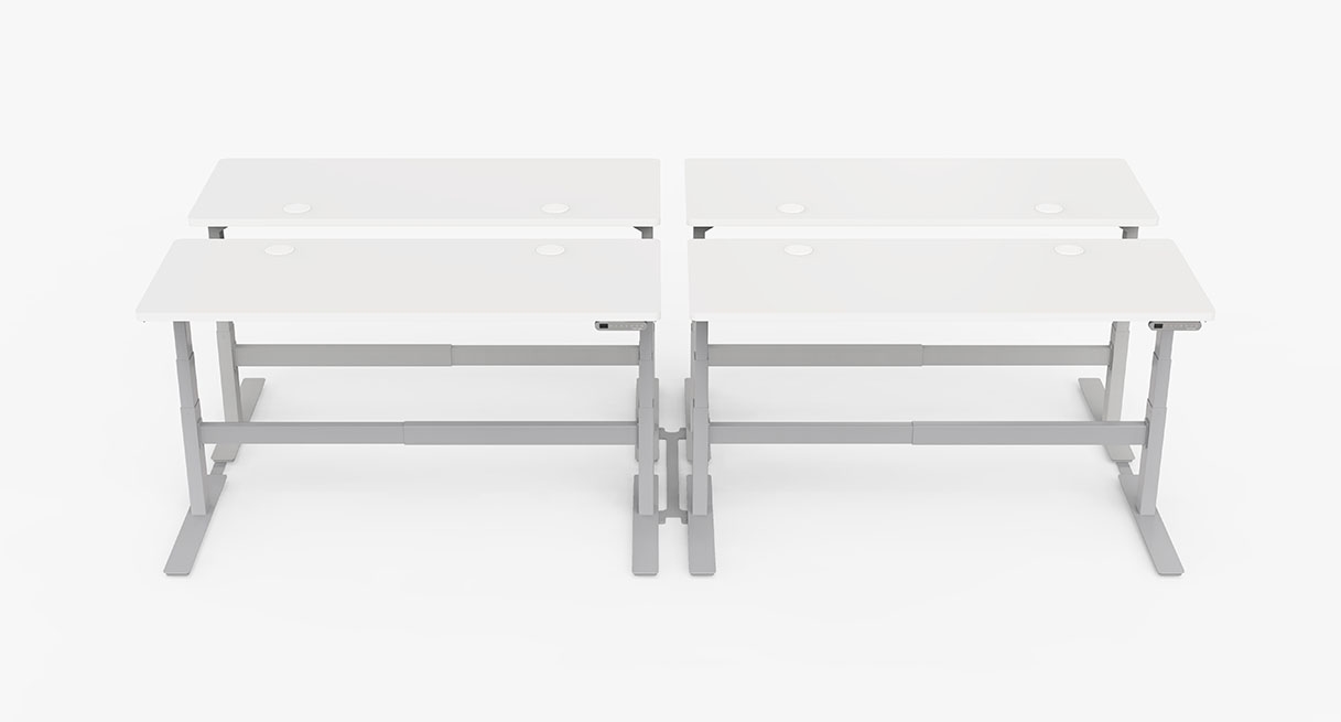 A benched desk layout with four sit stand desks