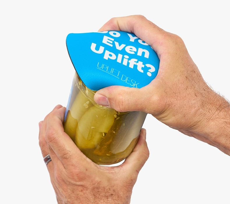 UPLIFT Jar Opener is used on a jar of pickles