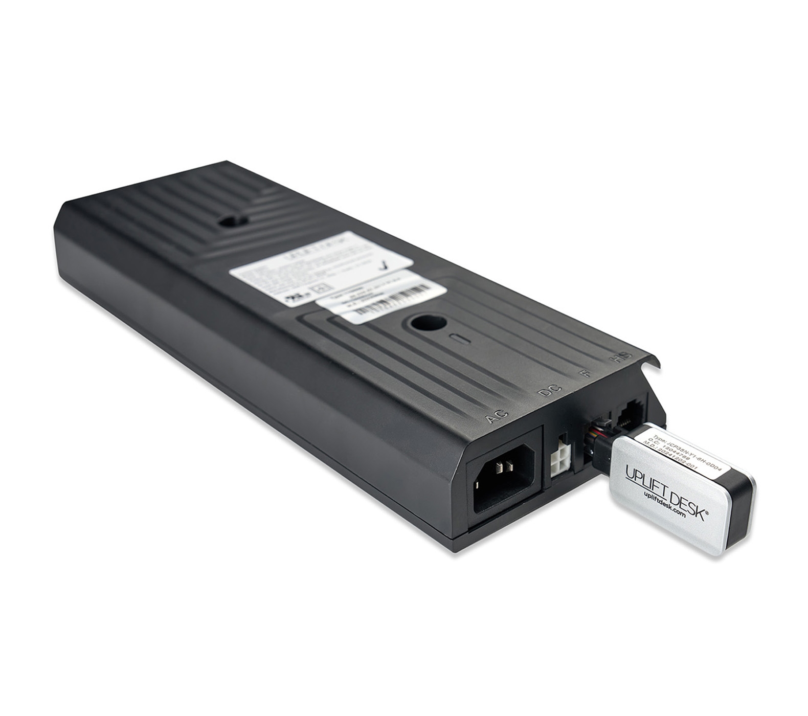 A Bluetooth Adapter plugged into an UPLIFT Desk control box
