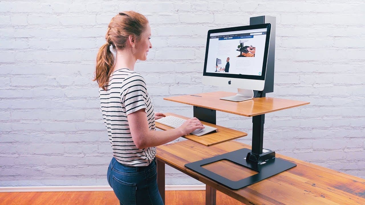 The E7 Electric Standing Desk Converter by UPLIFT Desk