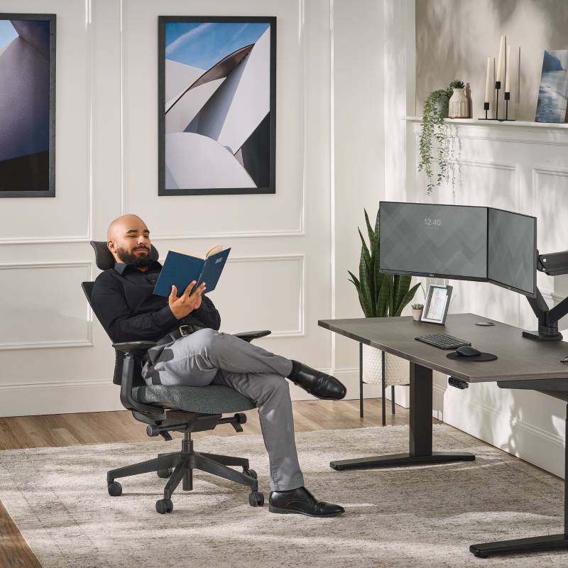 Person leaned back in a Clarksville Ergonomic Chair with Headrest