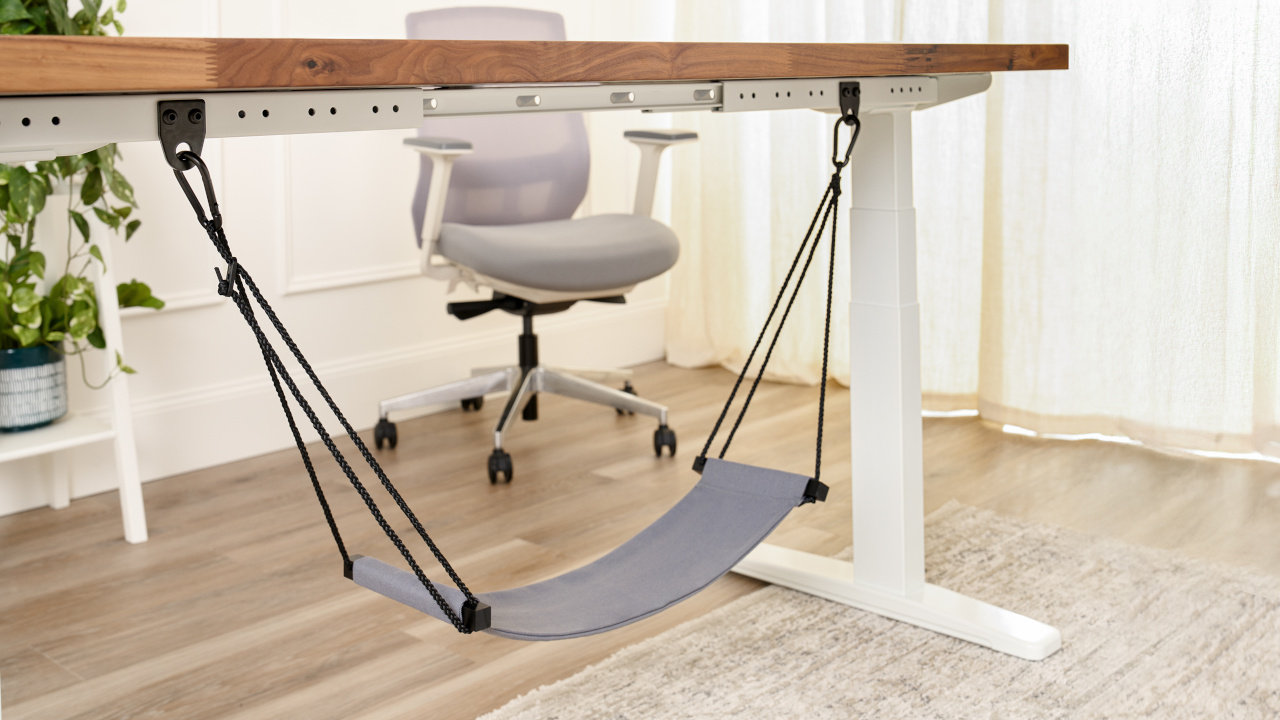 Under desk Foot Hammock attached to an Uplift Standing Desk with Anchor Plates.