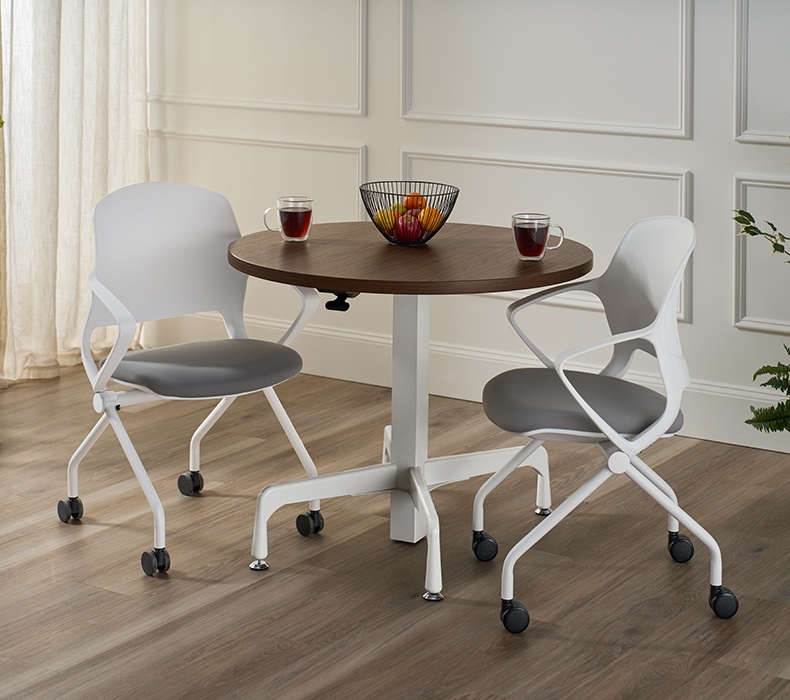 An UPLIFT Height Adjustable Bistro Table and Flex Chairs in a breakroom