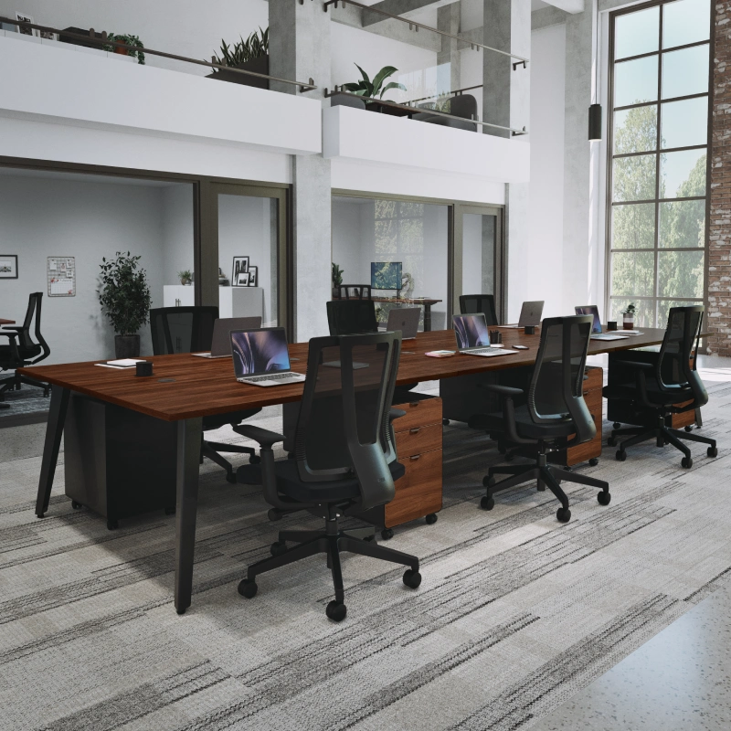 6-Person Table by UPLIFT Desk in Walnut Laminate with a black frame and black Clarksville Ergonomic Chairs