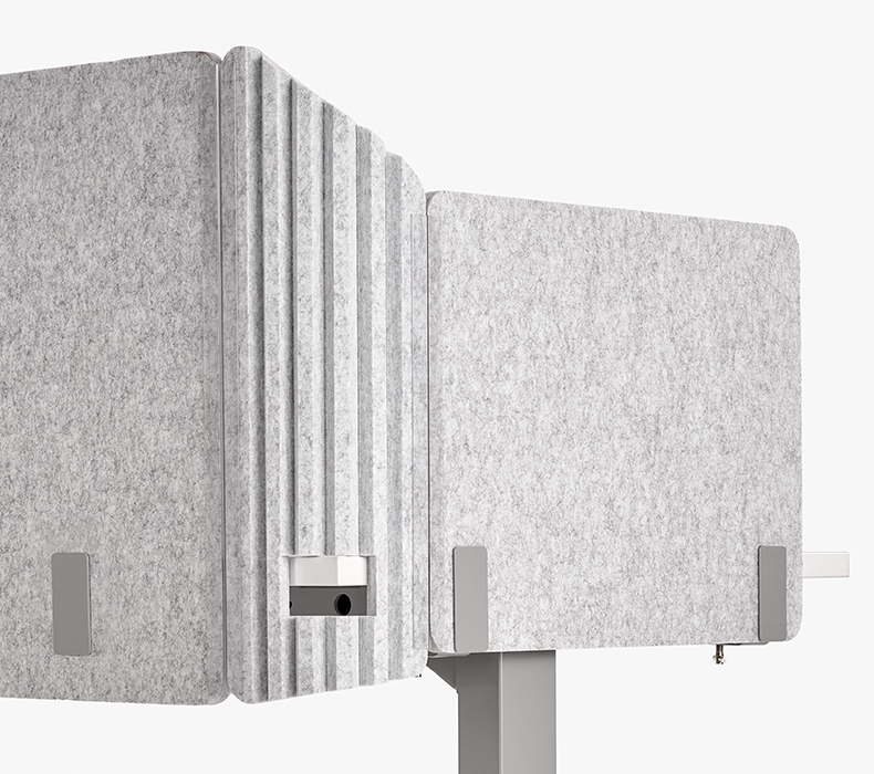 Acoustic privacy corner insert is scored with cutout for perfect fit on desk corners