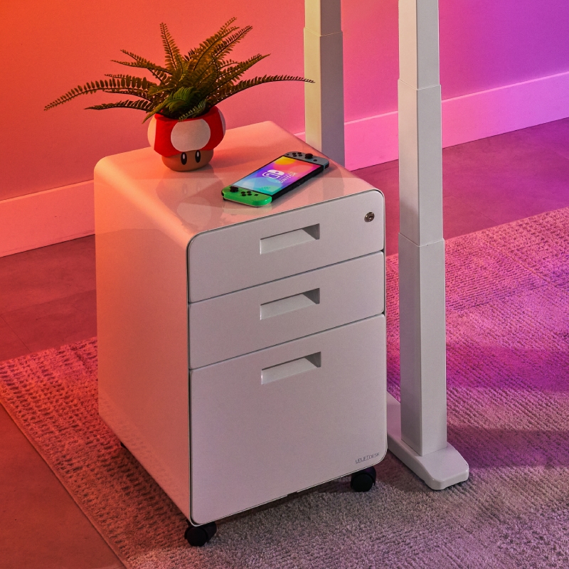 3-drawer file cabinet by UPLIFT Desk in a gamer’s room.