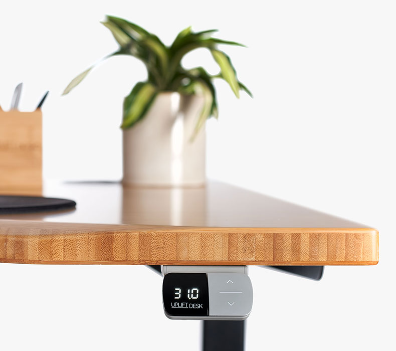 A Basic Display Angled Keypad by UPLIFT Desk mounted to a 60" x 30" Bamboo Standing Desk