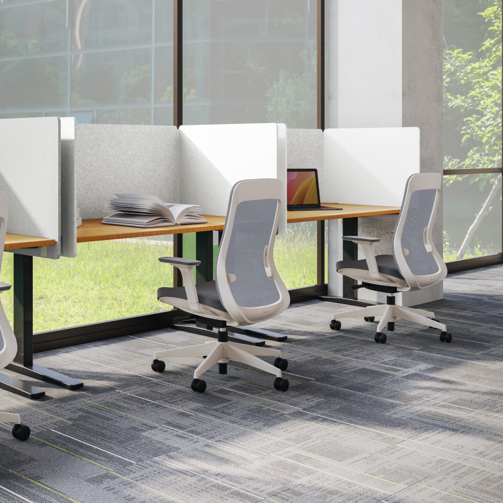 row of bamboo standing desks with bolan chairs and acoustic panels