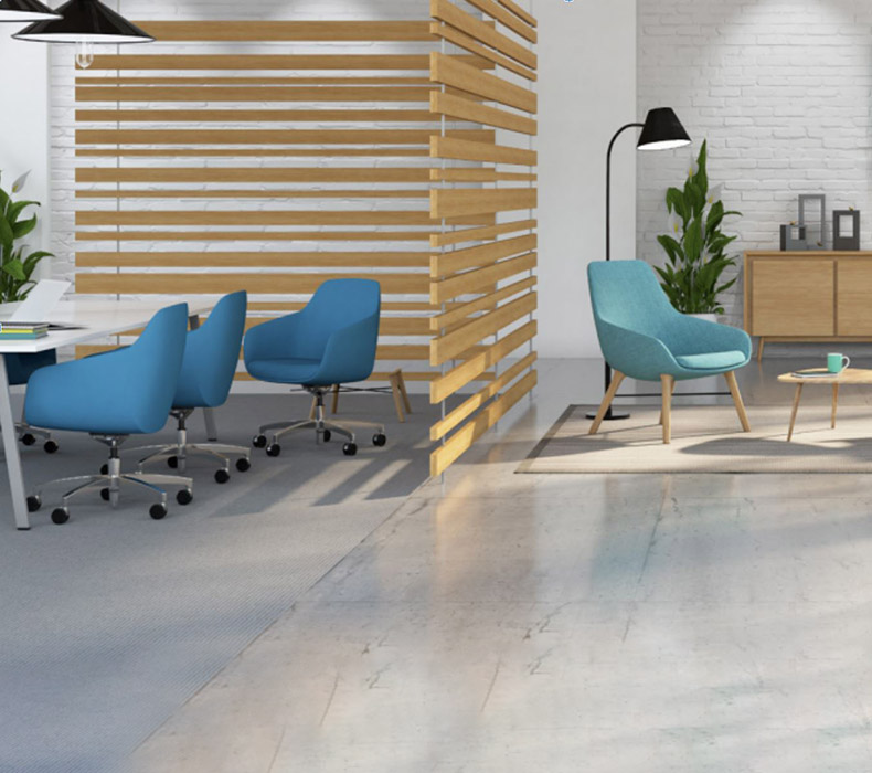Multiple lounge areas with Lilly Side Chairs in an industrial office space