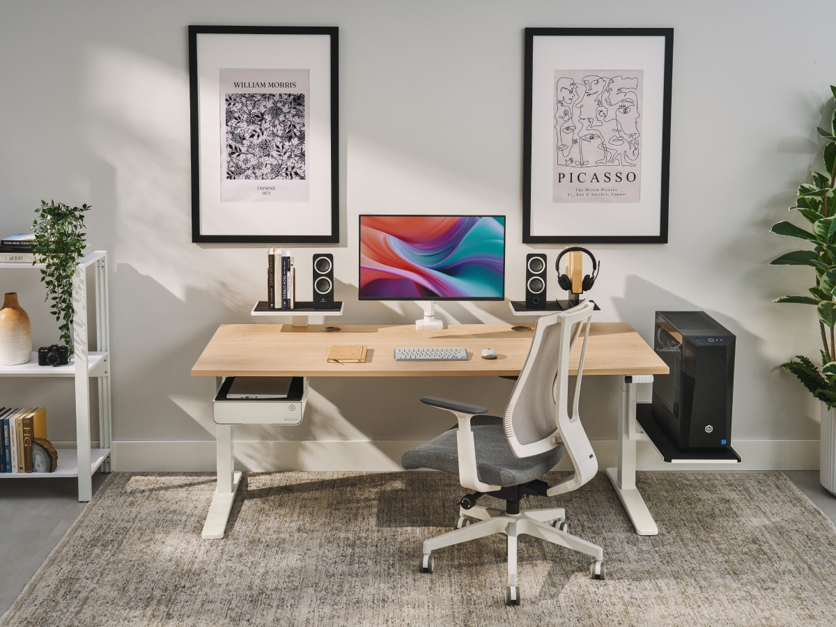 Shelving on desktop supporting desktop speakers