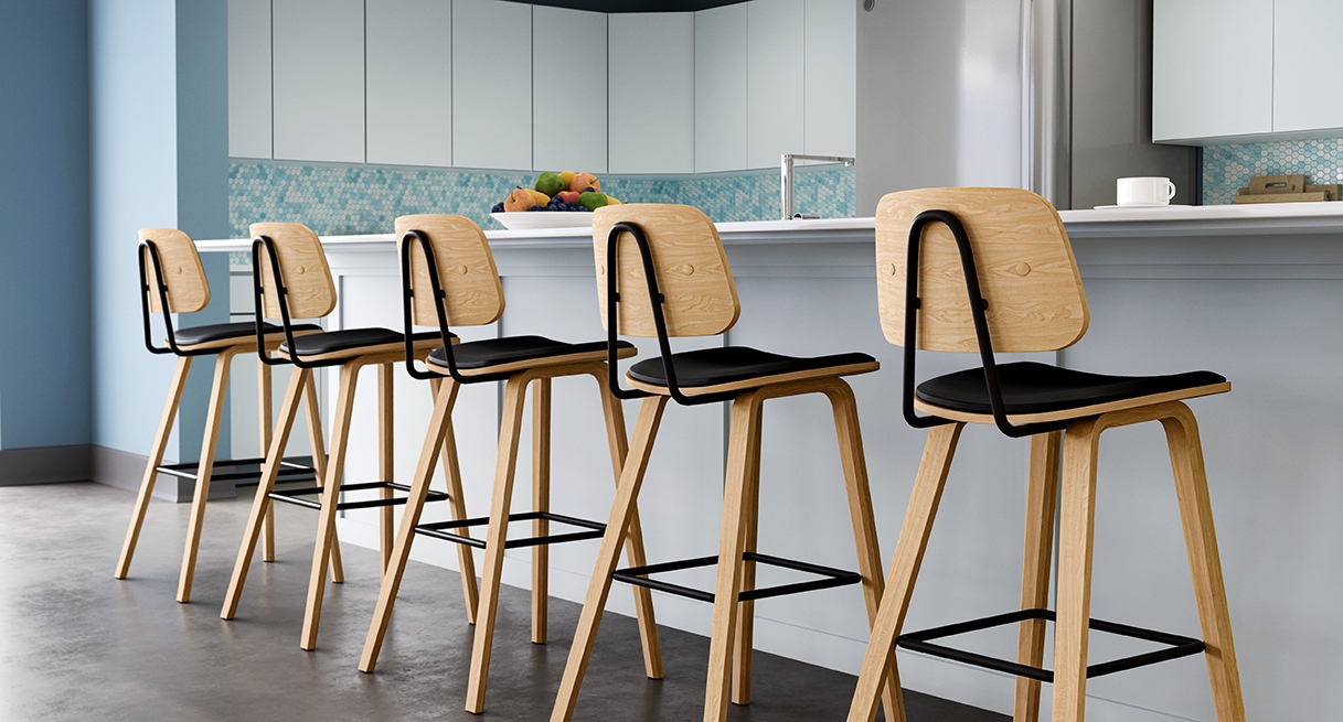 Five Kerbey Barstools by UPLIFT Desk in a line at a bar-height countertop