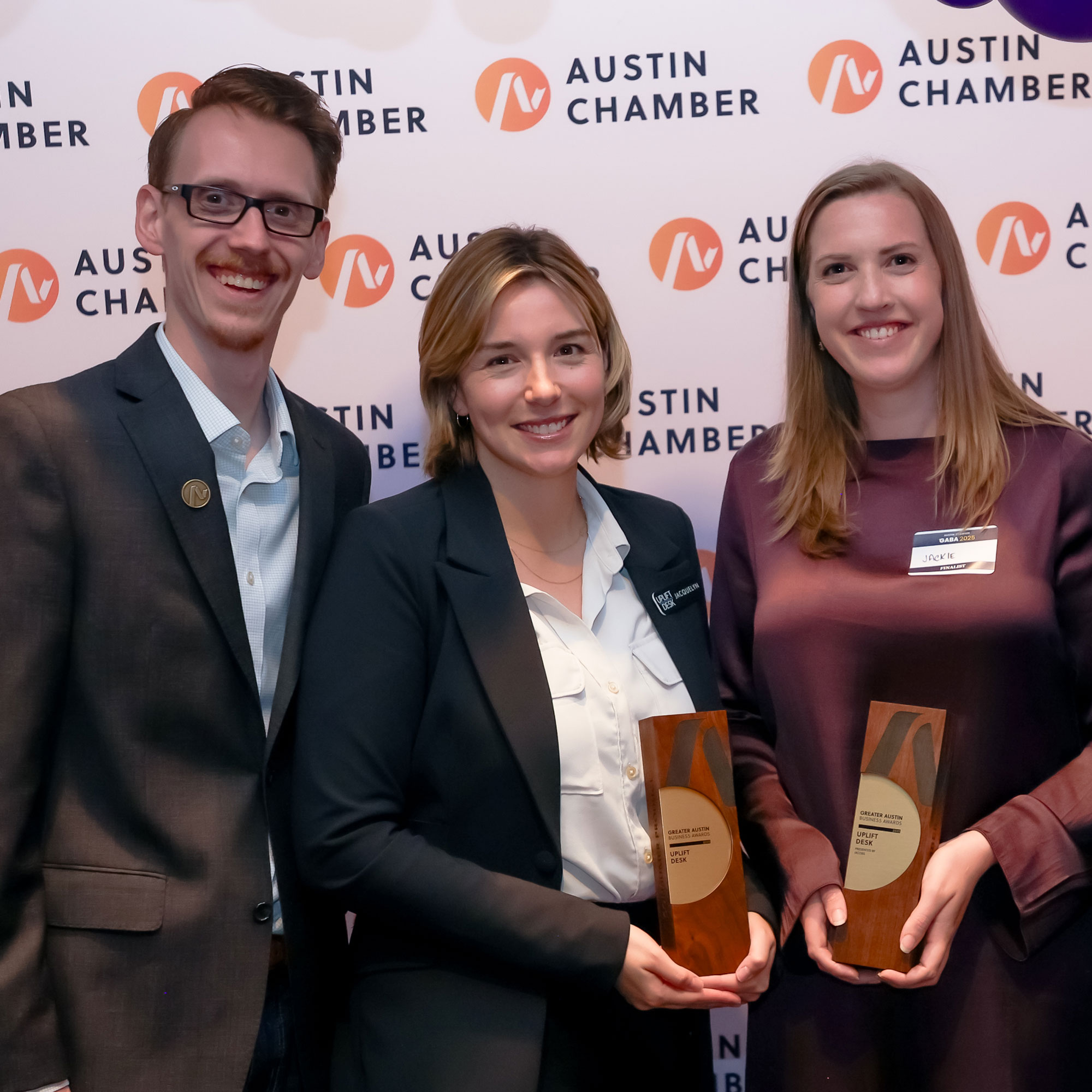 UPLIFT Desk employees receiving awards from Austin Chamber