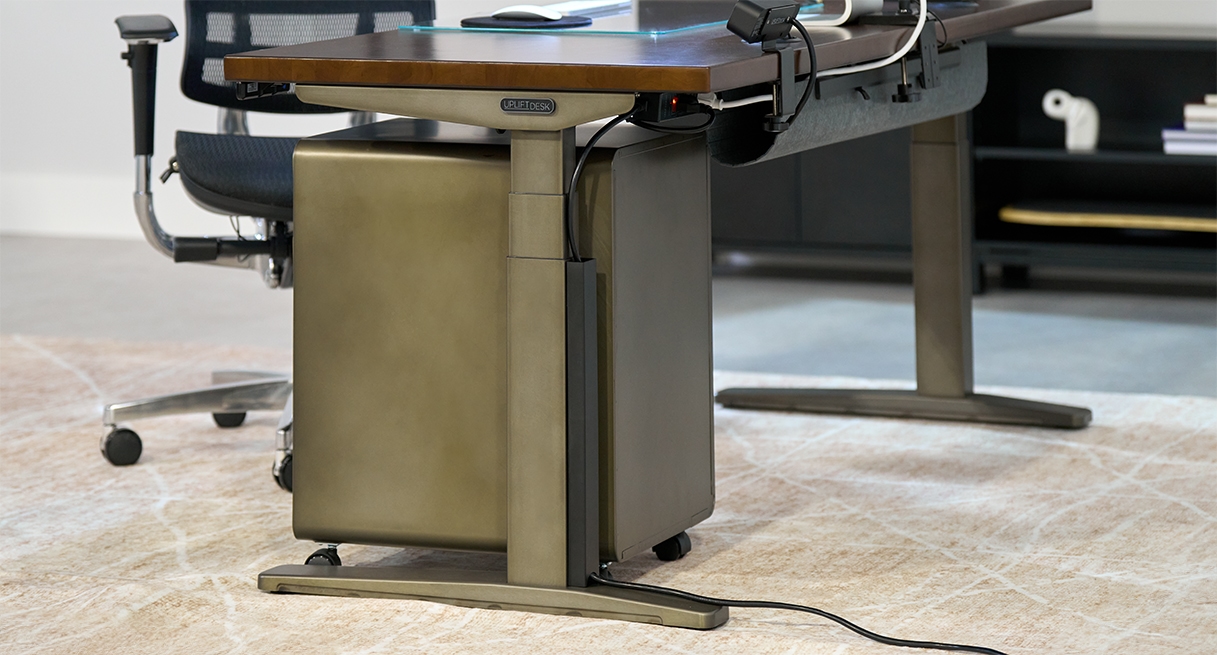 UPLIFT Standing Desk with industrial frame, featuring Magnetic Cable Channel and matching desk accessories in the same finish.