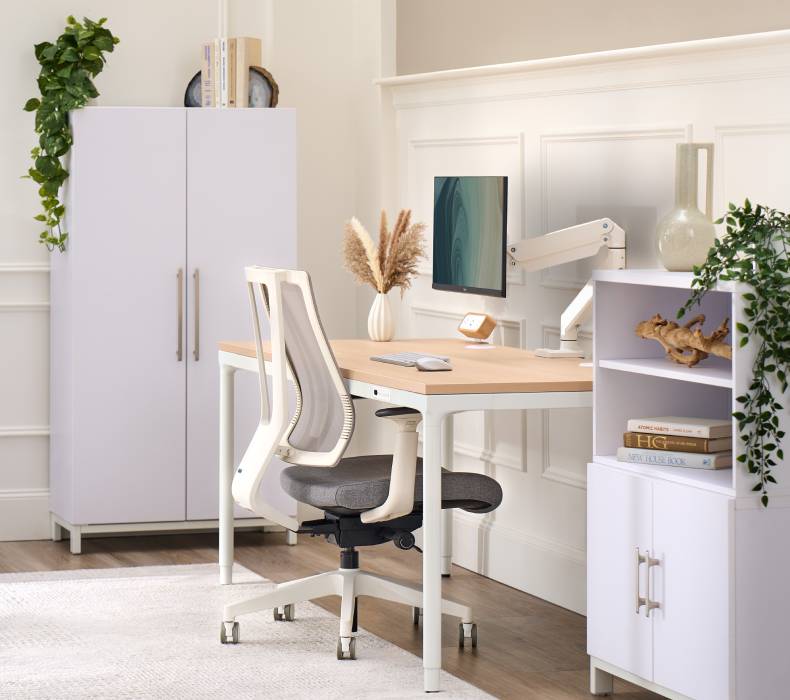 A side-view of Clarksville Ergonomic Chair at an Parsons Standing Desk by UPLIFT Desk.