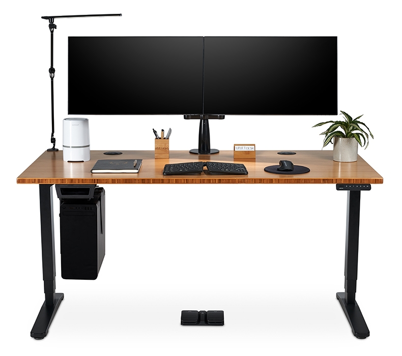 Wireless Foot Switch by UPLIFT Desk featured underneath a standing desk