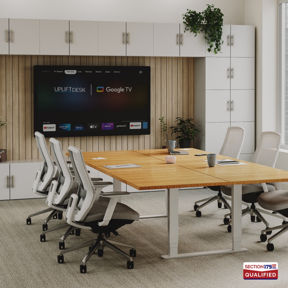 Conference room outfitted with a height adjustable conference table and envoke ergonomic chairs by UPLIFT Desk.