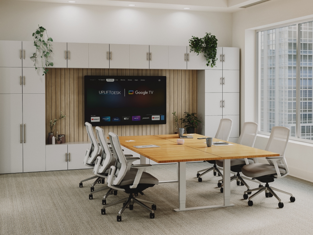 Conference room with a height adjustable conference table, Mopac cabinets, and Envoke Ergonomic chairs by UPLIFT Desk.