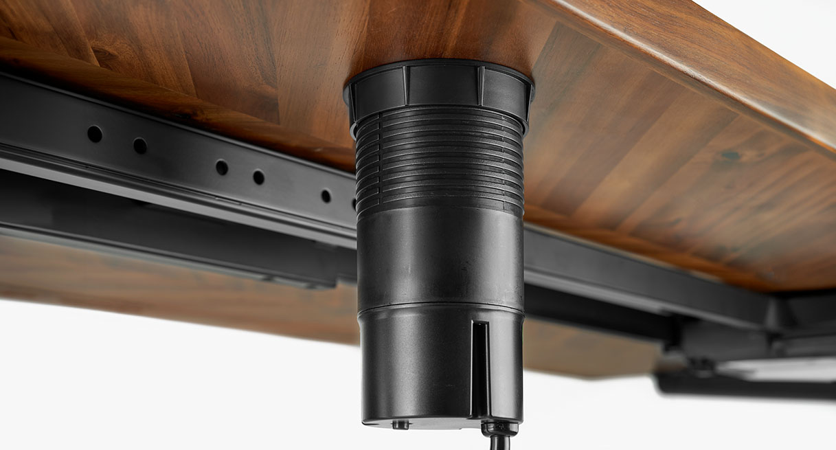 The locking ring of the Pop Up Power Grommet below the desktop