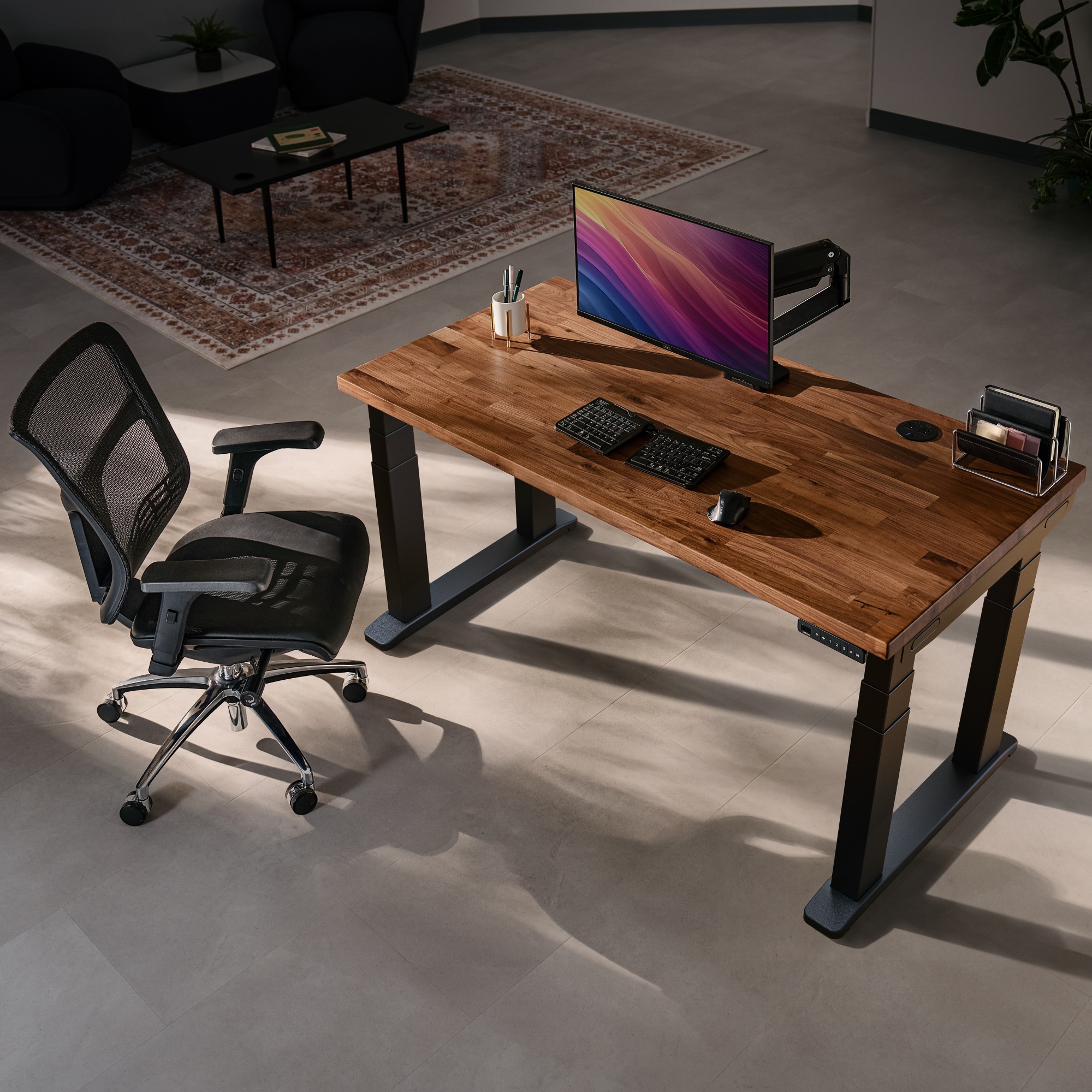 Bird's-eye view of an UPLIFT V3 4-Leg Standing Desk with black frame and solid wood desktop