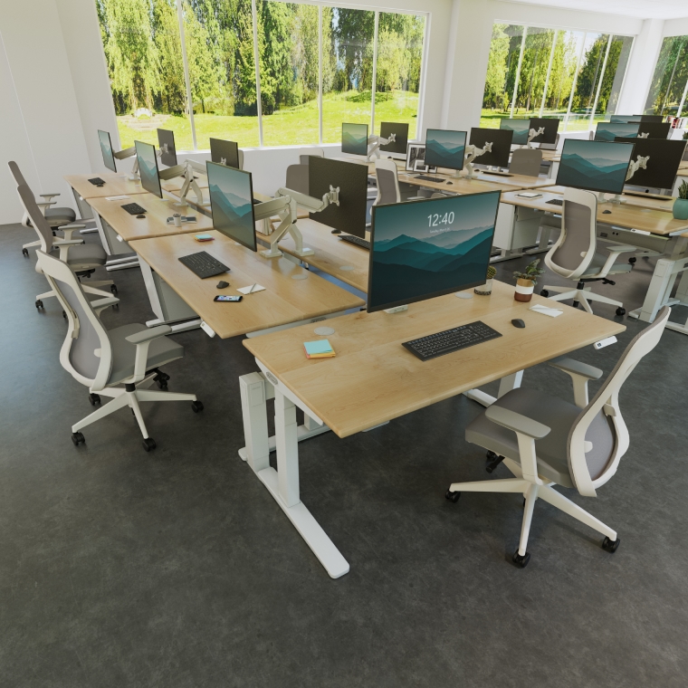 Dual row of UPLIFT Standing Desks with a desk benched to the end of the row, showcasing the T-Rail’s functionality.