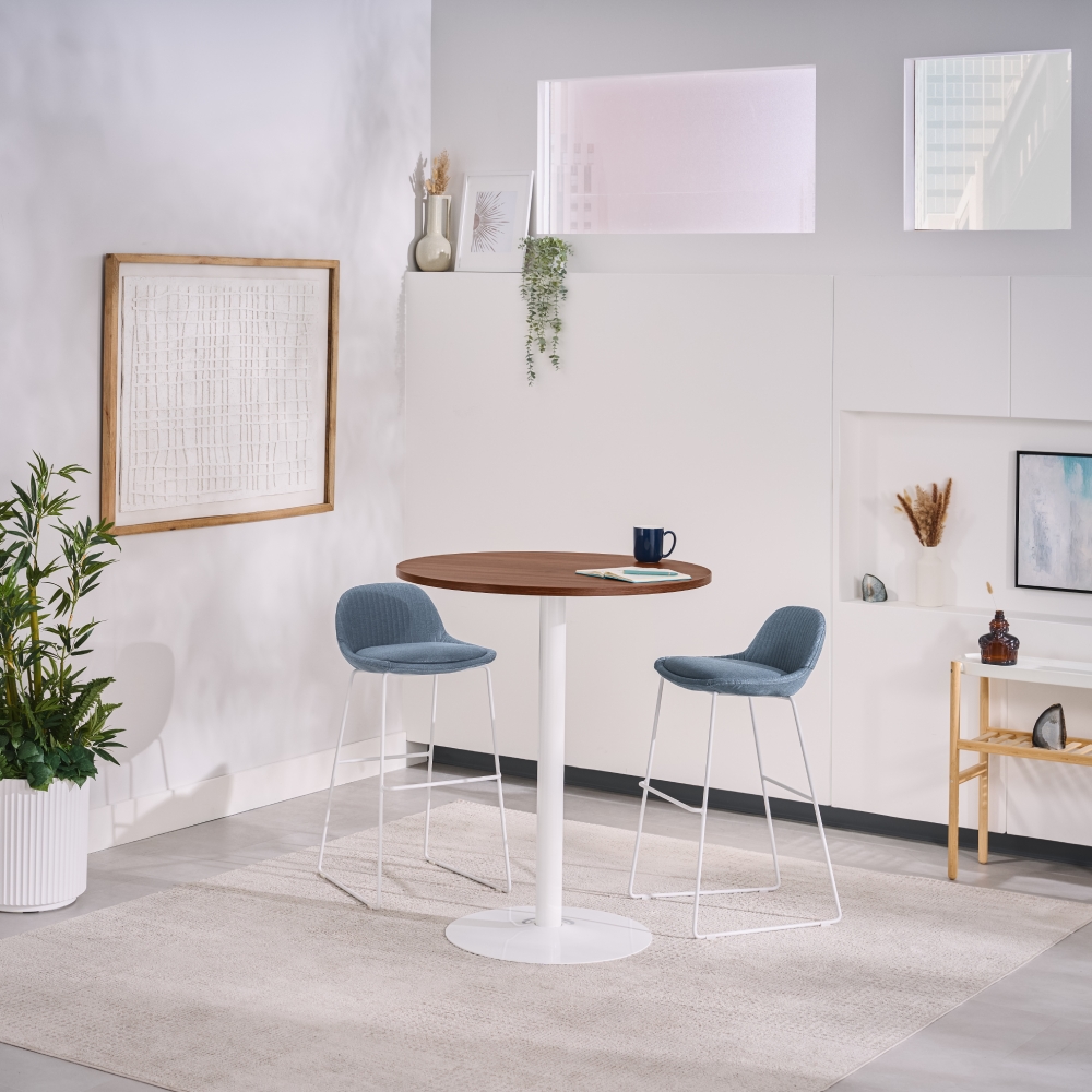 The Cafe Table by UPLIFT Desk with a white base and Walnut Laminate tabletop