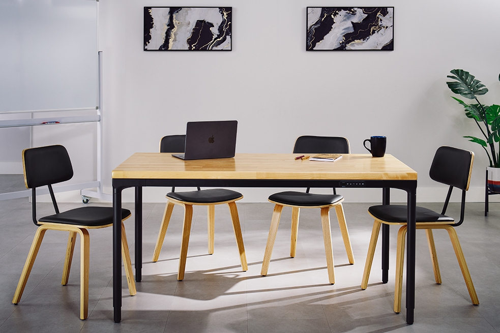 Parsons standing desk by UPLIFT Desk in a collaborative setting with a white board and 4 Kerbey Chairs.