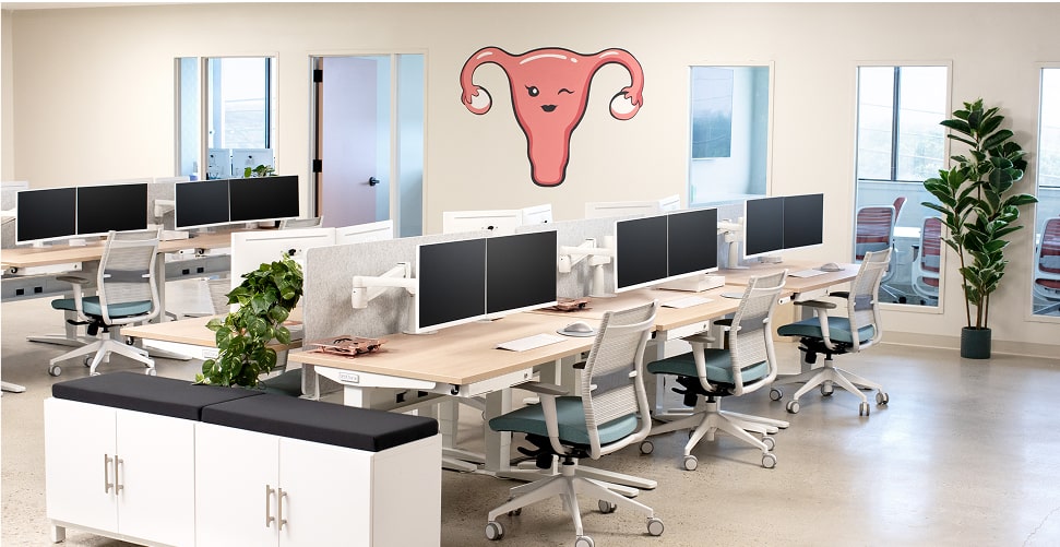 Legendairy Milk office, outfitted with UPLIFT Desk products featuring standing desks, ergonomic chairs, and storage solutions