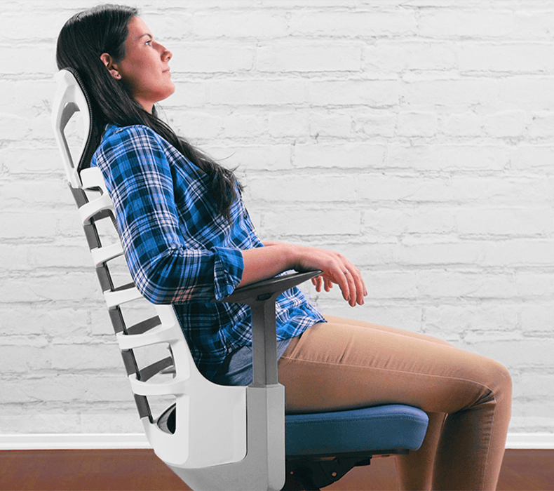  A woman leaning back in a Vert Ergonomic Chair