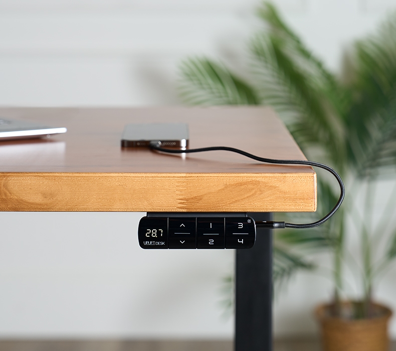 Advanced Keypad with USB in black mounted under an UPLIFT Standing Desk