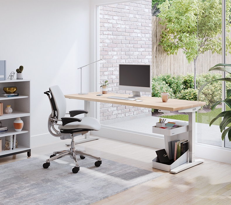 The Humanscale Freedom Chair without Headrest in luxurious brown leather with sleek chrome accents.