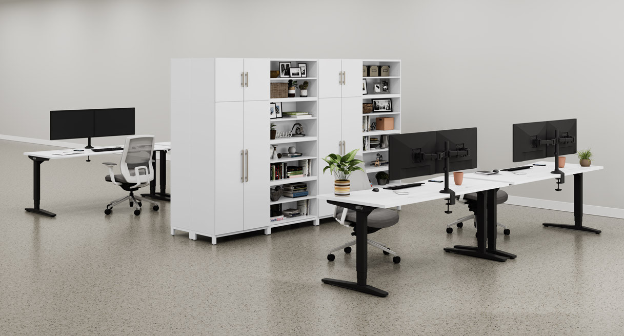 White MoPac Cabinets and Wardrobes create a partition between between two rows of matching white UPLIFT Standing Desks