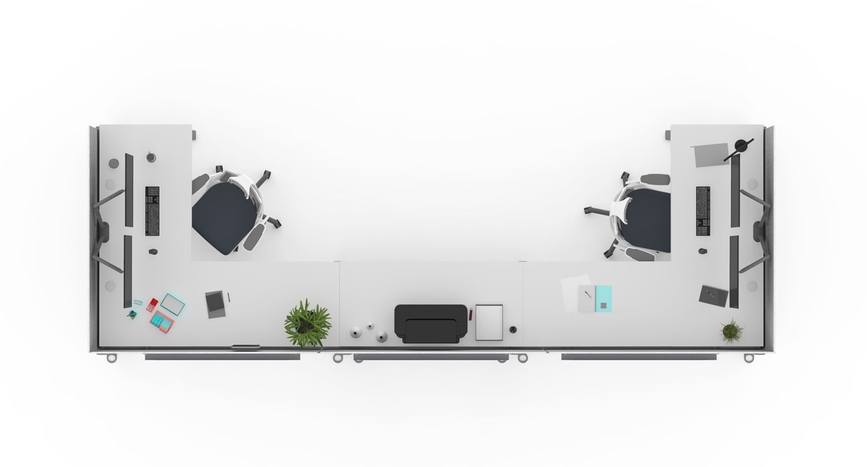 Looking down at two desks and a side table arranged in the c-shape configuration