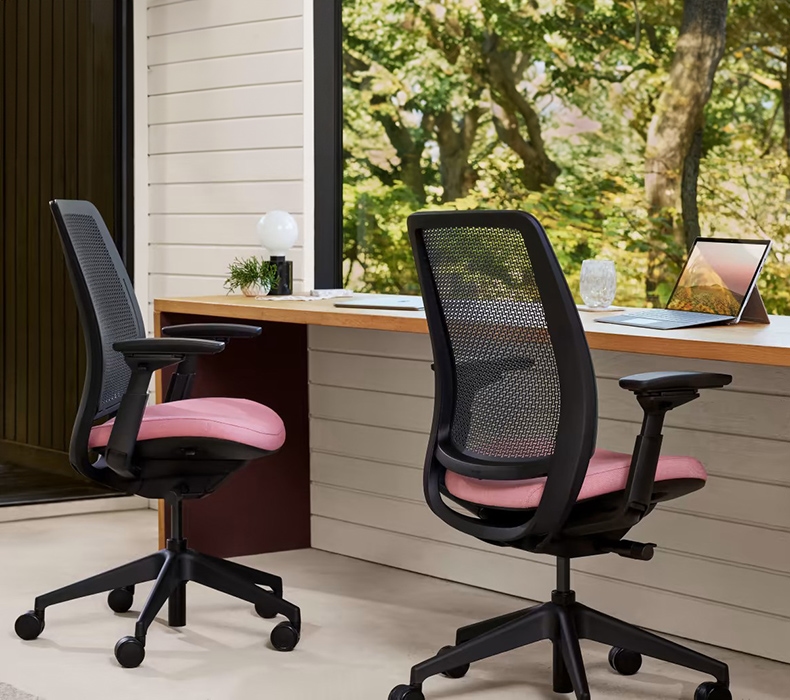 Two Steelcase Series 2 ergonomic office chairs in a group work setting