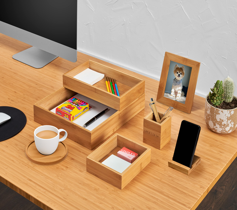 A Bamboo Desk Organizer Set paired with a Bamboo UPLIFT Sit to Stand Desk