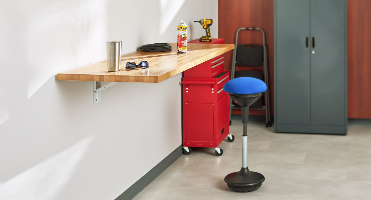 The folding table being used as a workspace in a garage