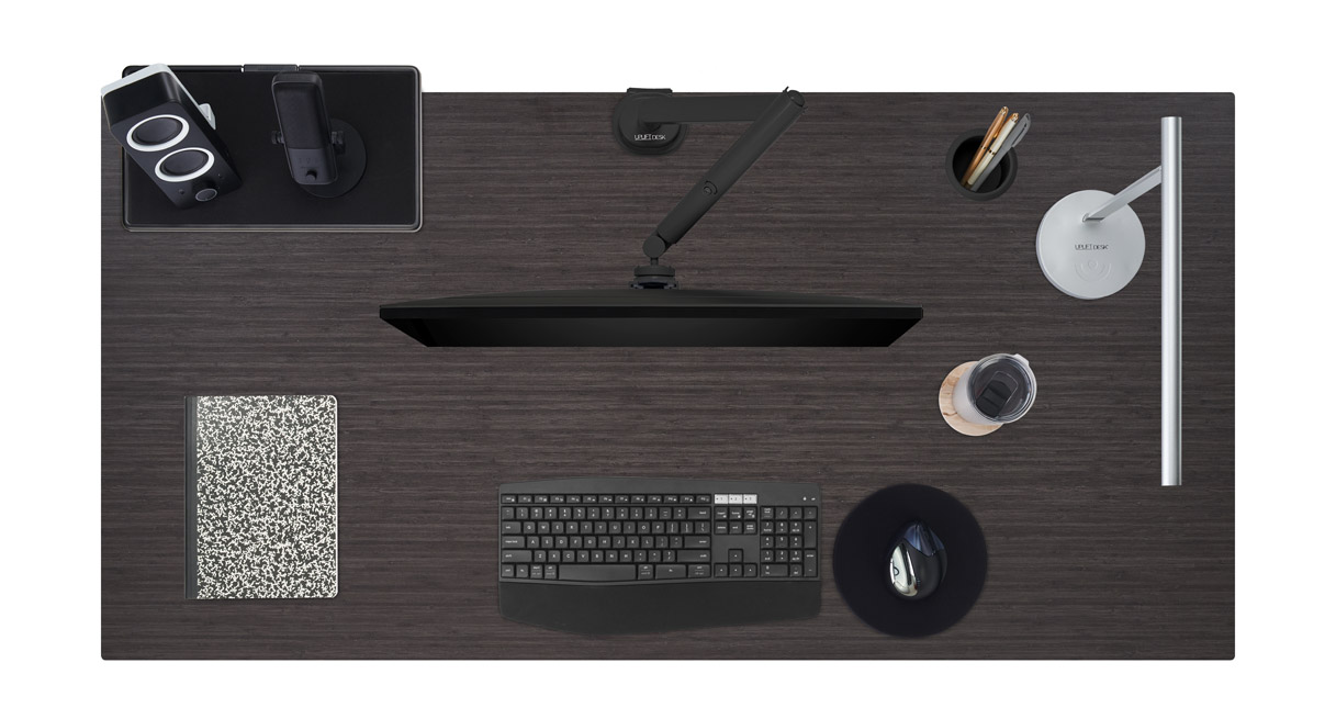 Ash gray laminate desktop with various desk accessories.