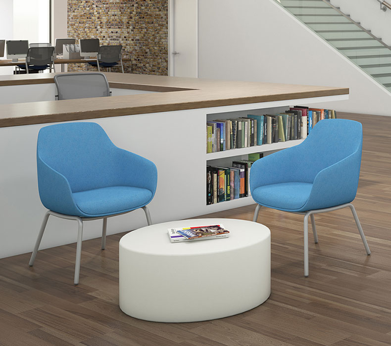 A lounge area with Lilly Side Chairs in an open office floorplan