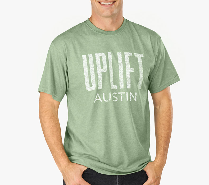 Front view of a person wearing a heather green Austin Short Sleeve T-Shirt