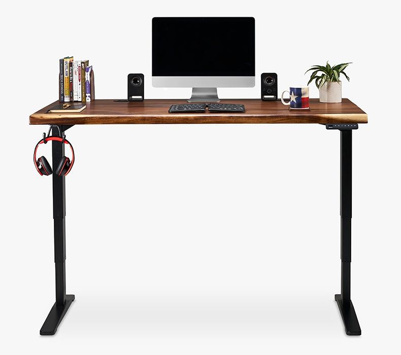 Headphones hanging from a Flexible Desk Hook mounted to a 60 inch desktop