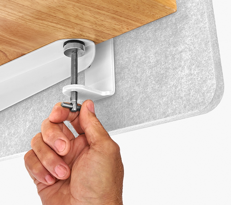 A hand tightening a mounting bracket on a 3-Sided Tall Acoustic Privacy Screen