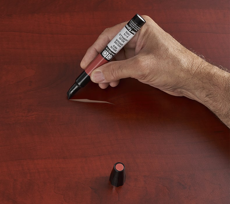 A wood pen from the Solid Wood Scratch Kit from UPLIFT Desk