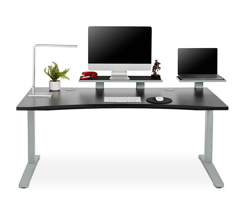 A 27 inch desk shelf used as a computer monitor stand and a 15 inch desk shelf laptop while attached to a standing desk