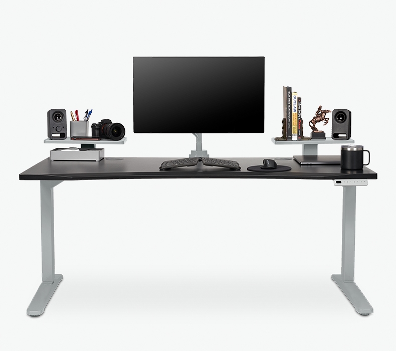 Two 15 inch Desk Shelves on a 60 inch x 30 inch standing desk with speakers, books, and other accessories