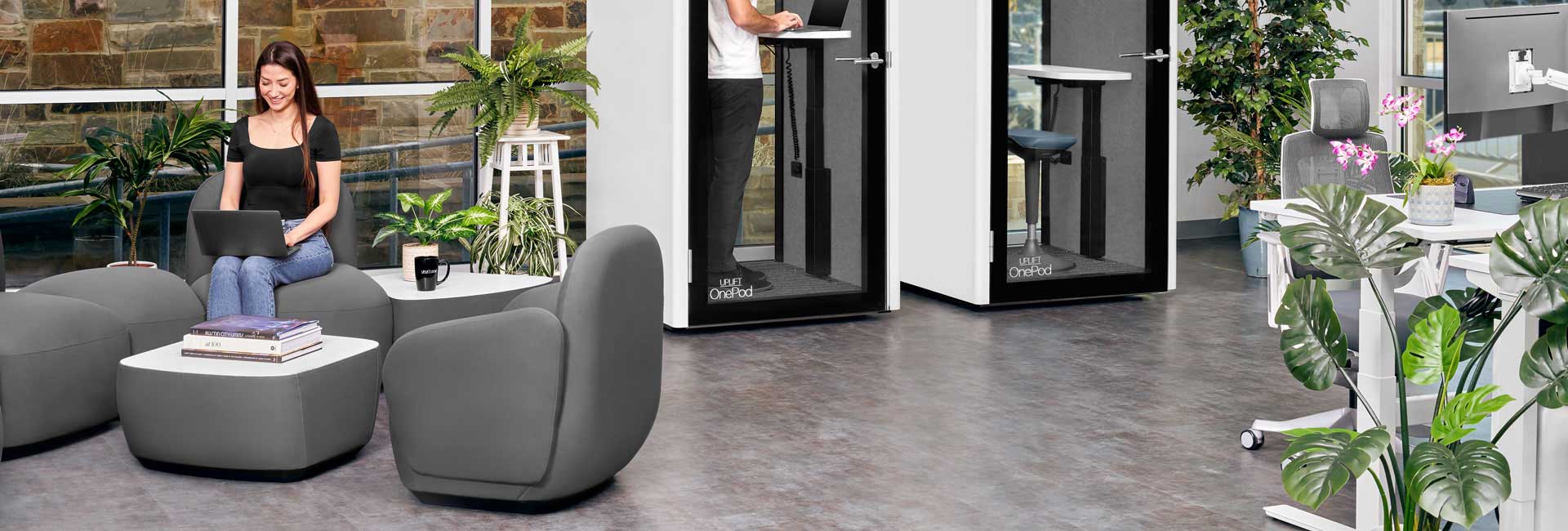 A Dillo Lounge Collection configuration with a OnePod Office Phone Booth in an office environment