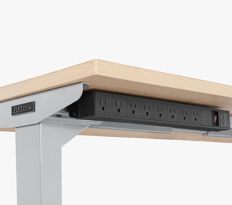 Surge Protector mounted to UPLIFT frame accessory mounting points with front-facing outlets