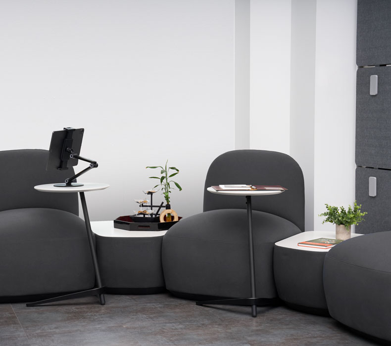 The Dillo side table shown with office lounge furniture